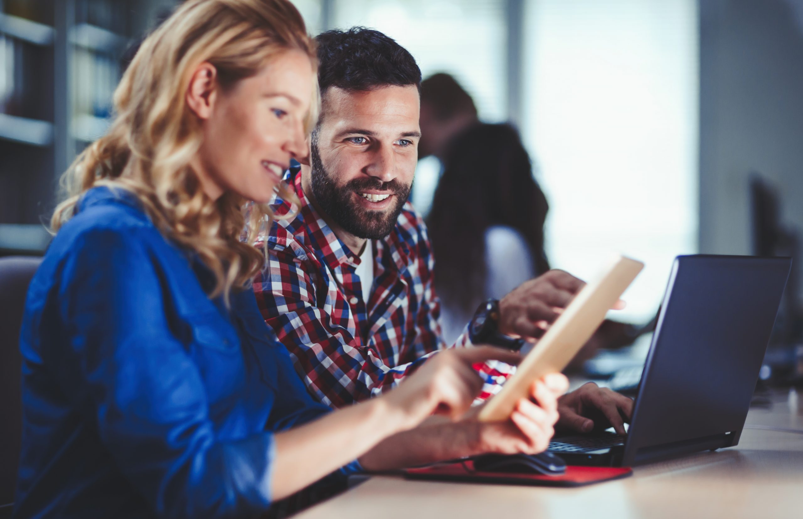 Programmers cooperating at information technology company WiFi